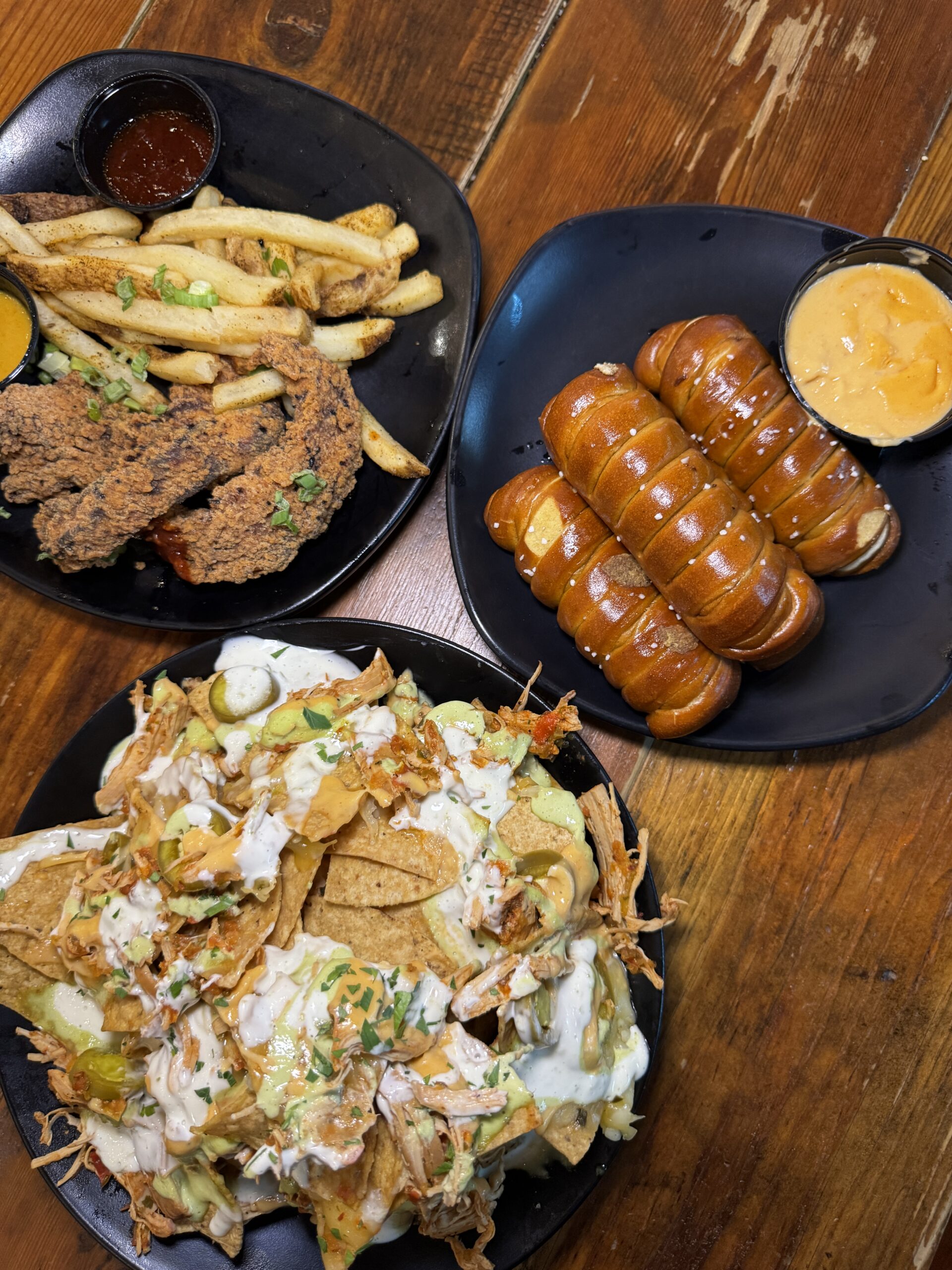 Nachos, wings, pretzels with cheese